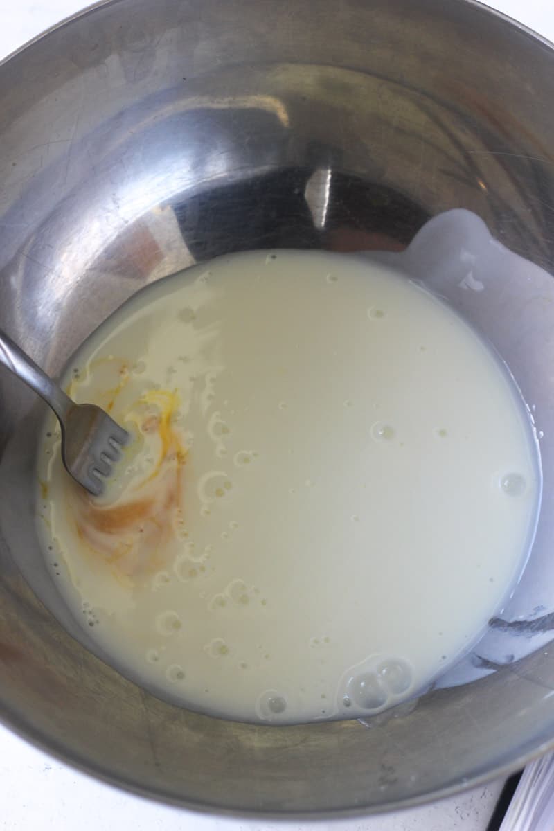 mixing milk with egg yolk