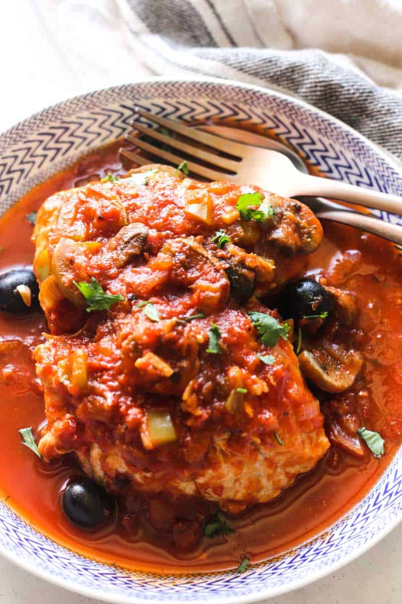 turkey cacciatore in the bowl with a fork