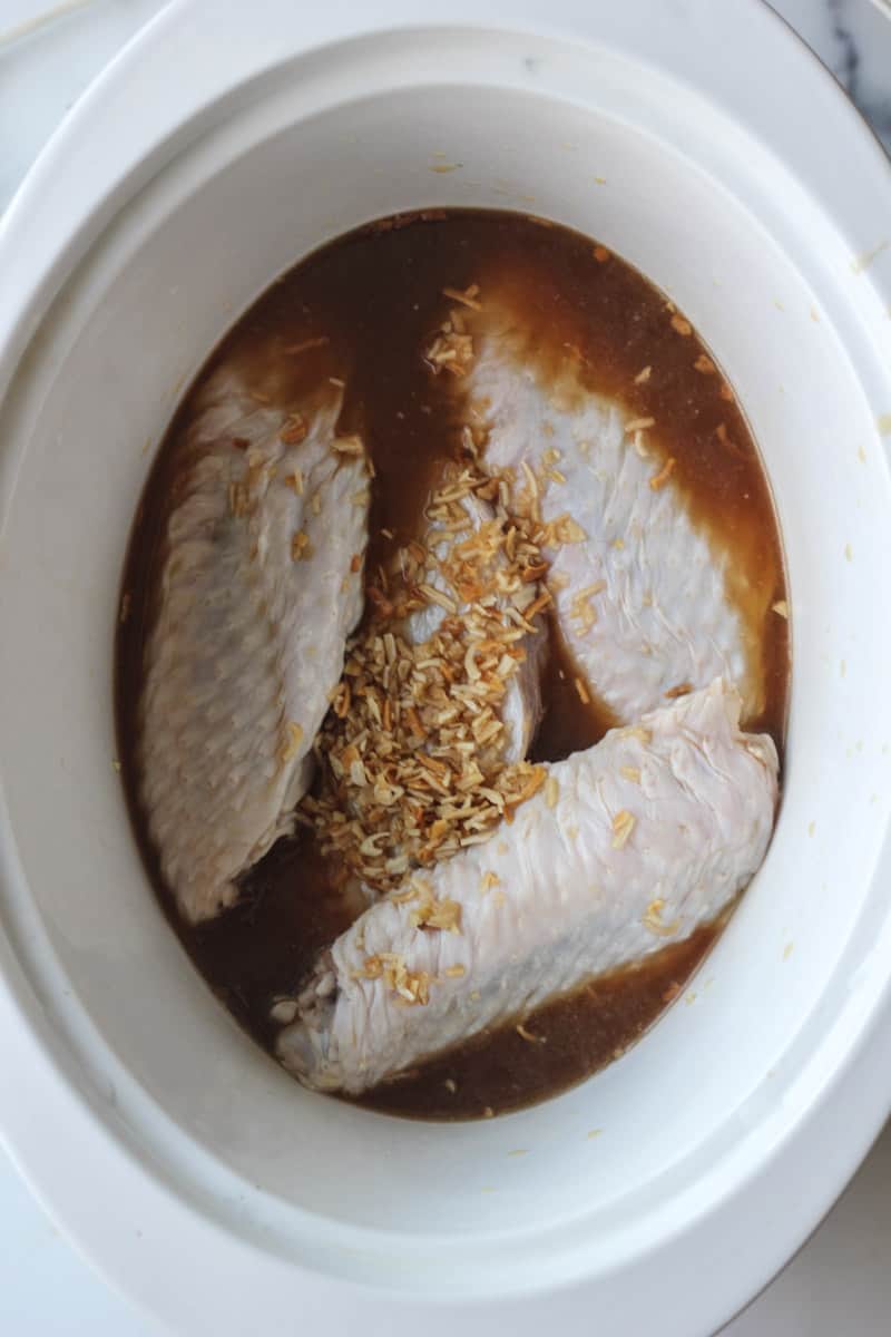 raw turkey wings with onion soup mix in slow cooker