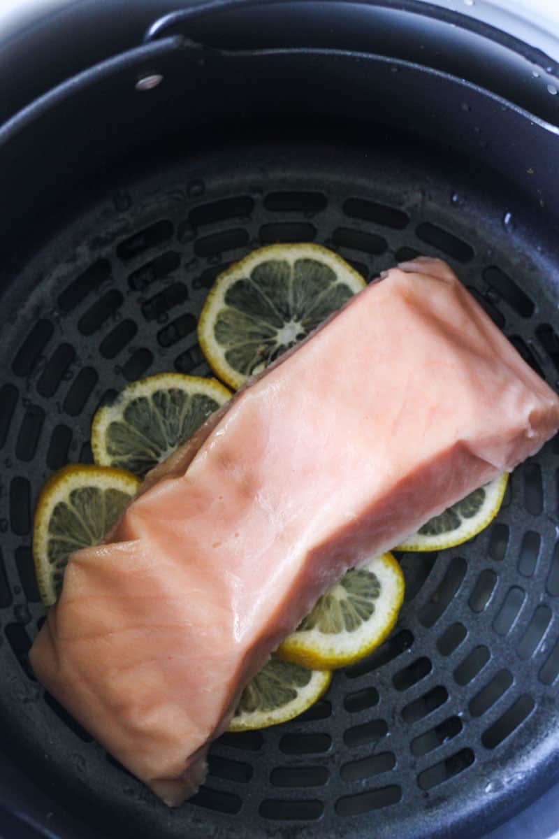 frozen salmon fillet on lemon slices in air fryer