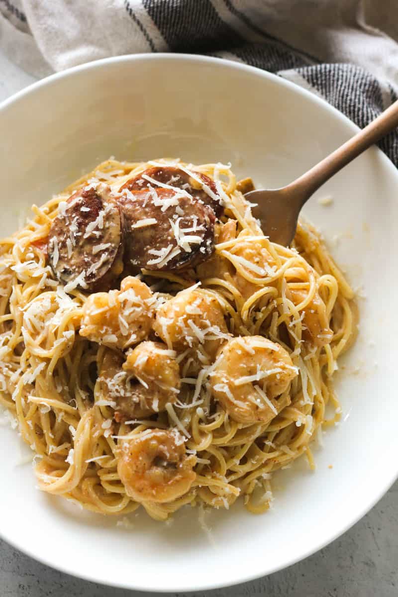 angel hair pasta with shrimp and smoked sausage covered with grated parmesan