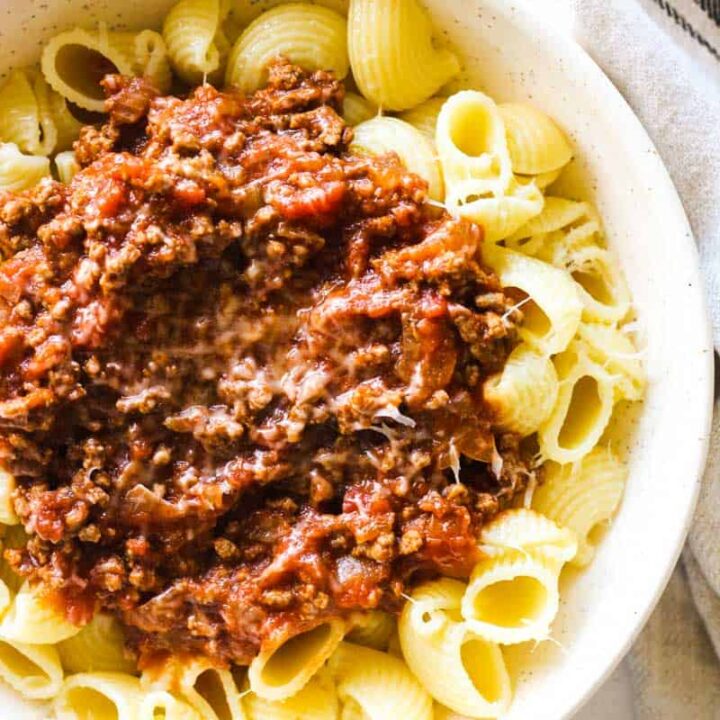 conchiglie bolognese pasta in a large plate