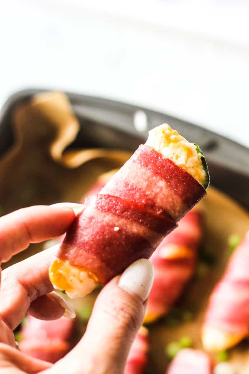 turkey bacon wrapped jalapeno popper in hand