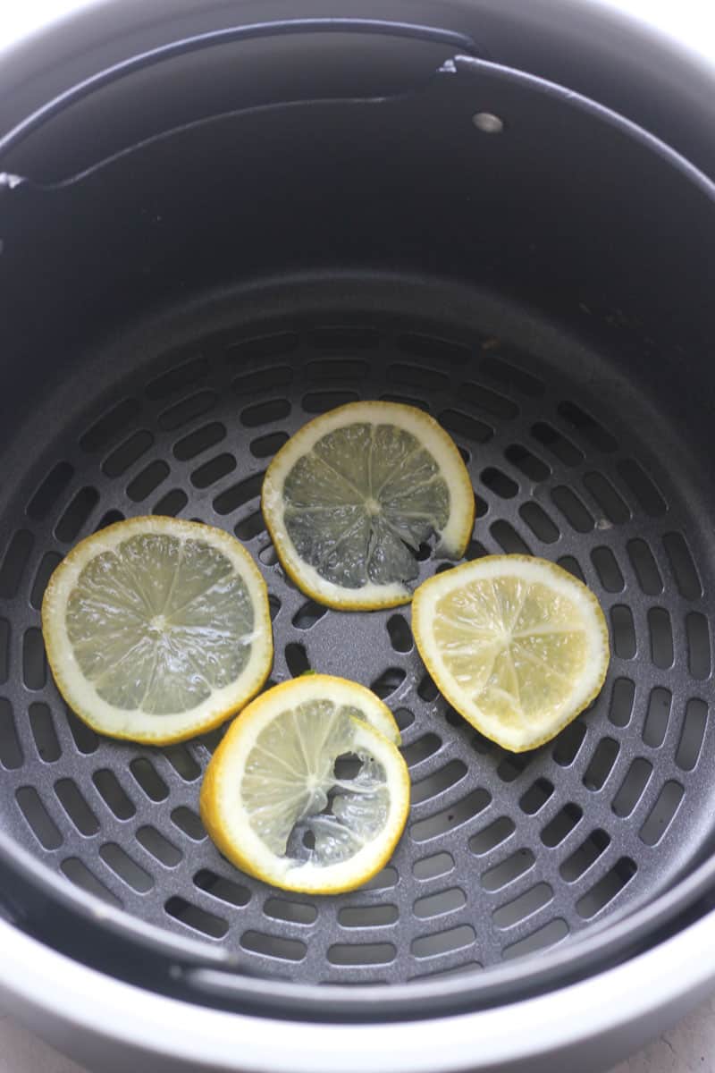 sliced lemons in the air fryer basket