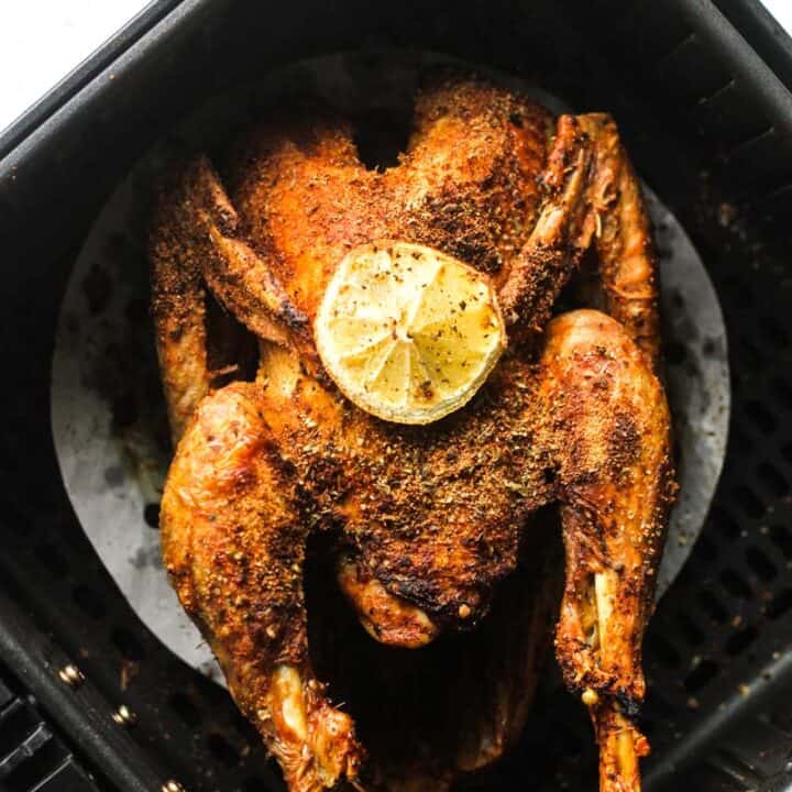 whole pheasant in air fryer with lemon slice on top