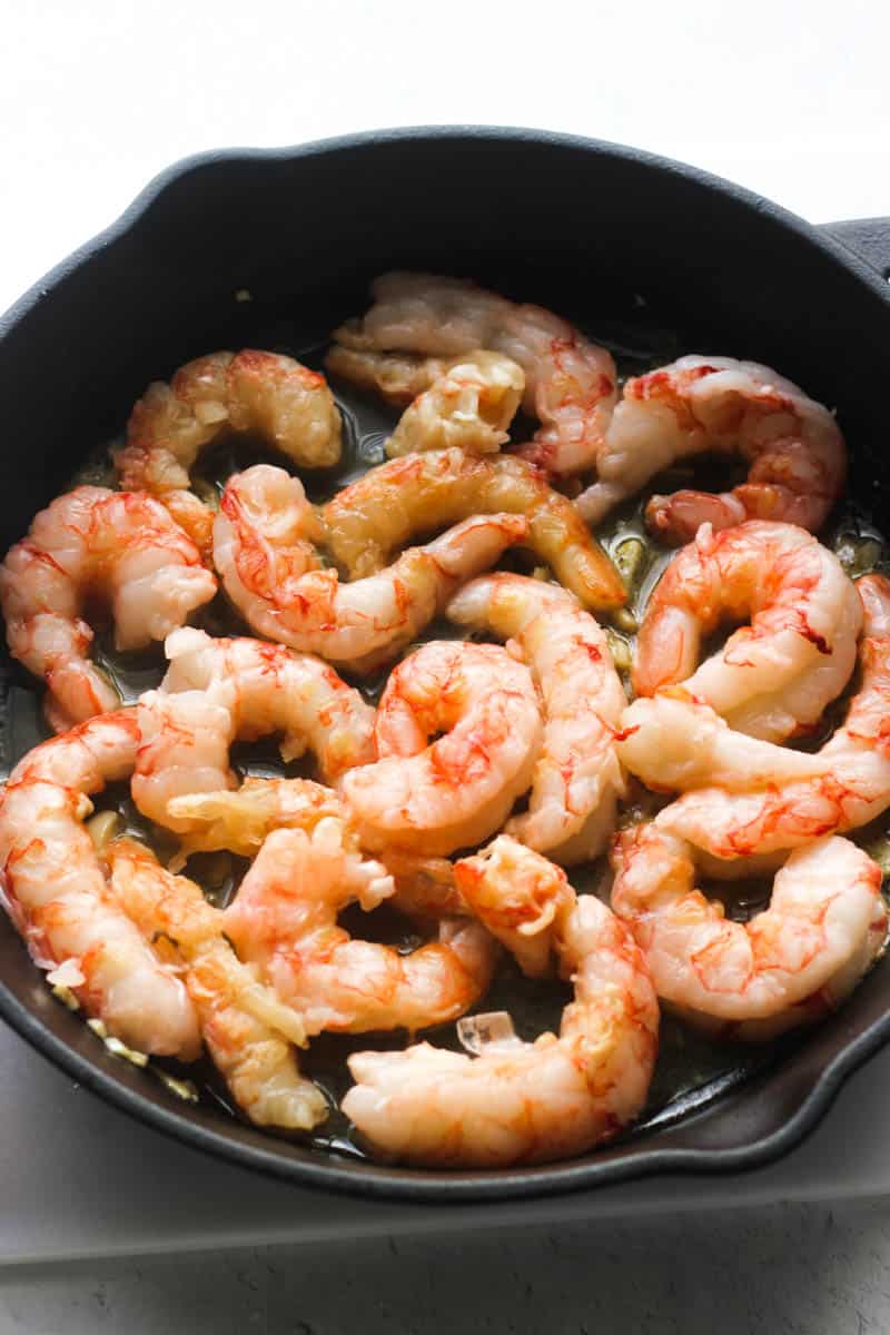 cooked red argentinian shrimp in cast iron skillet