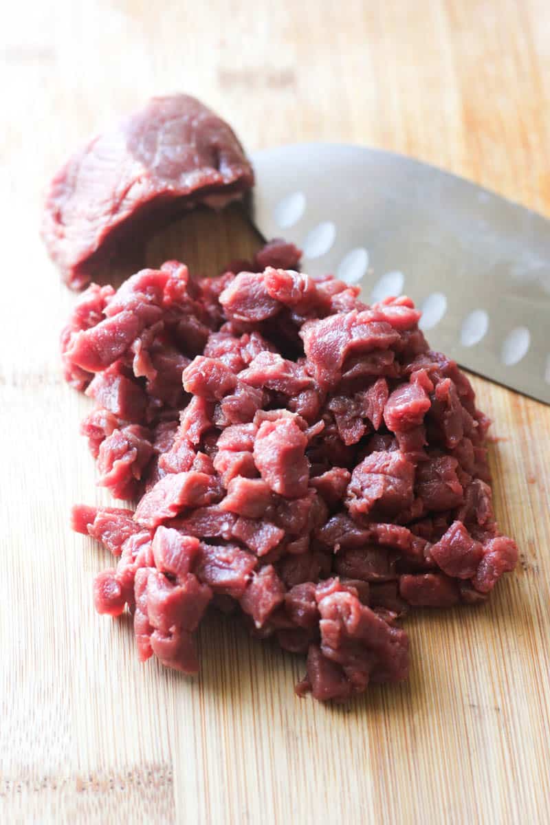 chopped bison on the cutting bowl