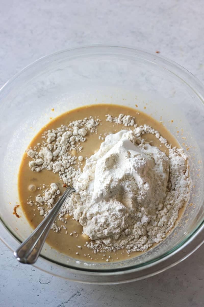 adding flour to the batter