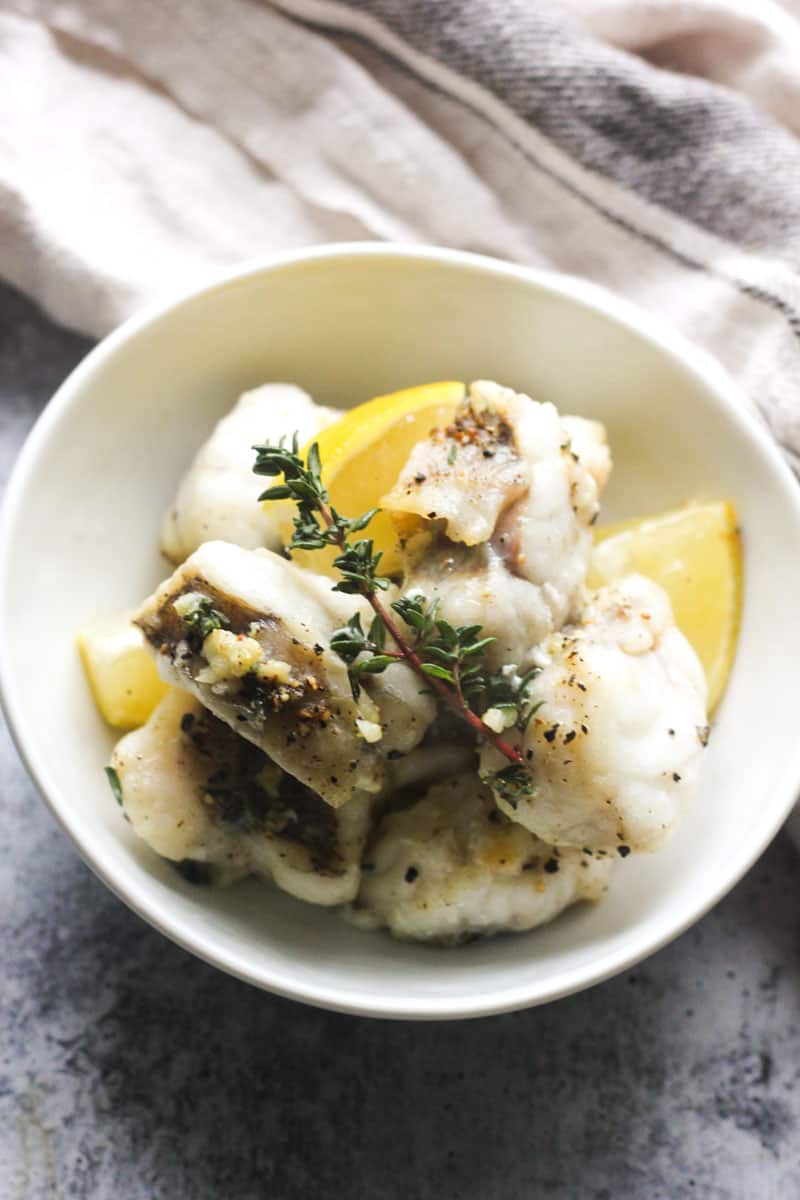 cooked air fryer monkfish fillets with thyme in a bowl