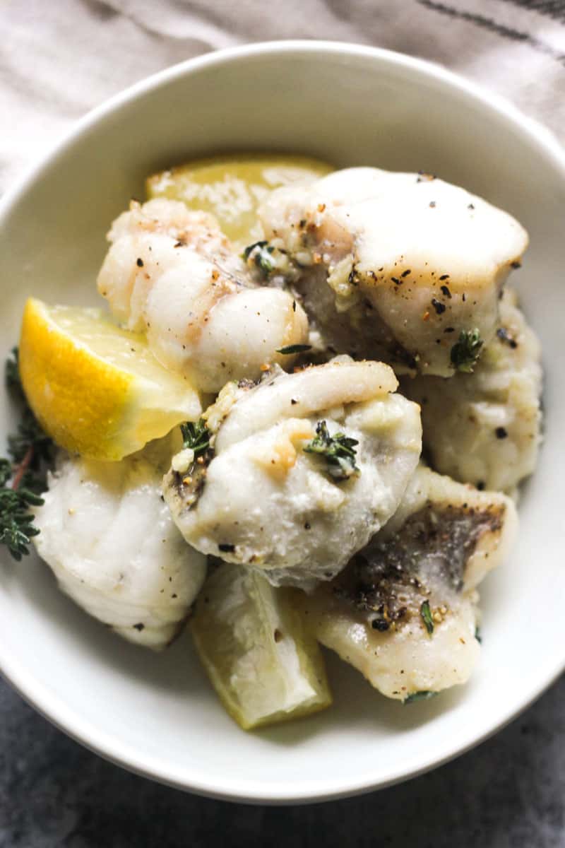 monkfish in the bowl with lemon and seasonings
