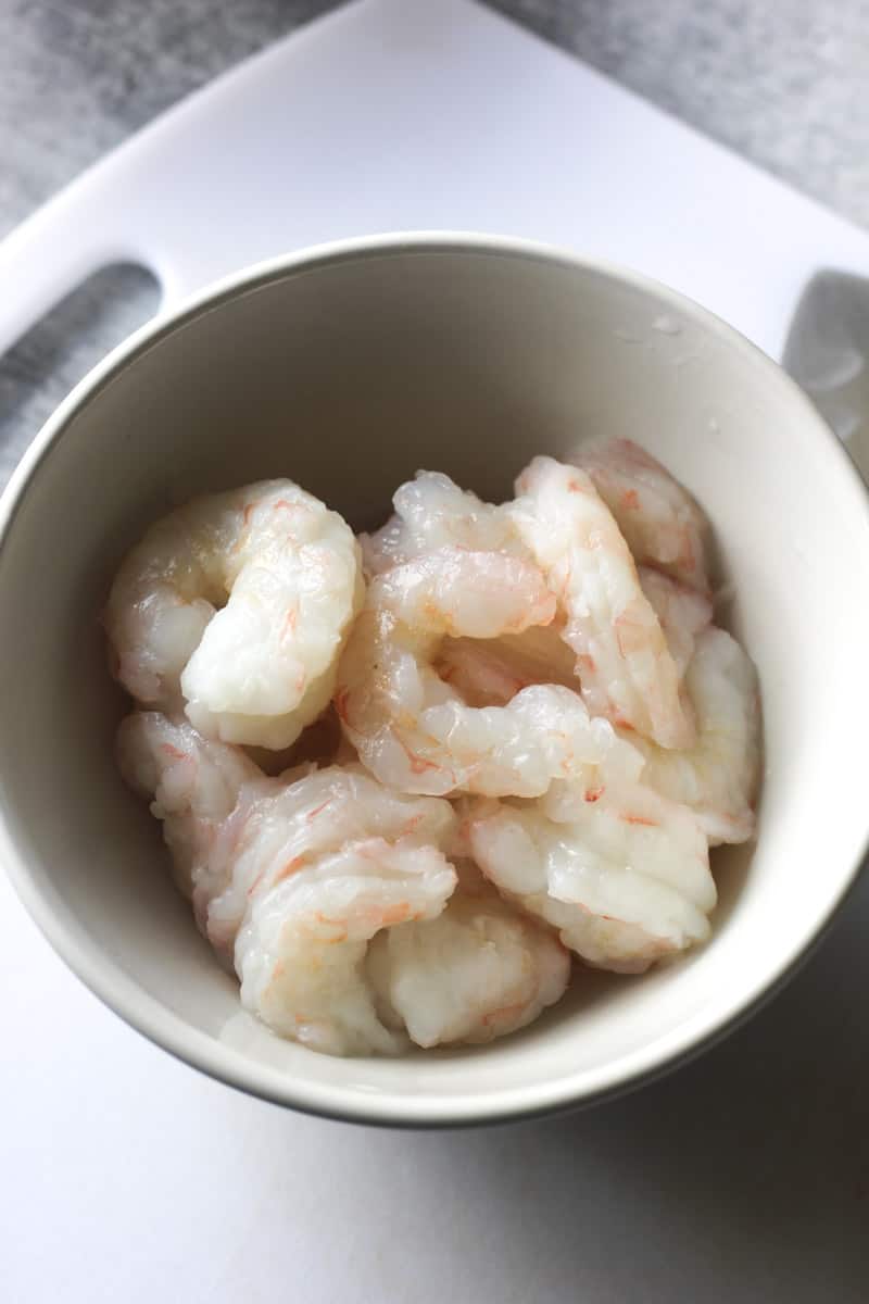 raw whole shrimp in the white bowl