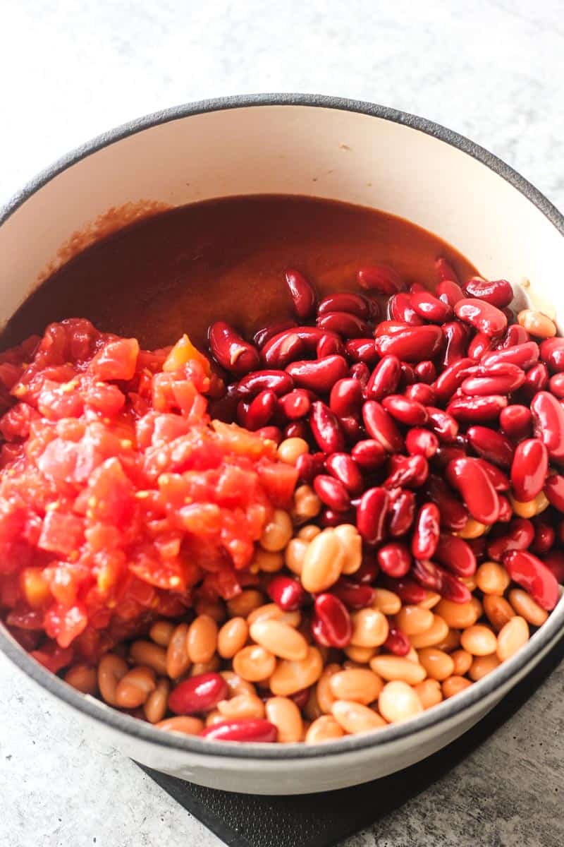 canned beans and diced tomatoes in the pot