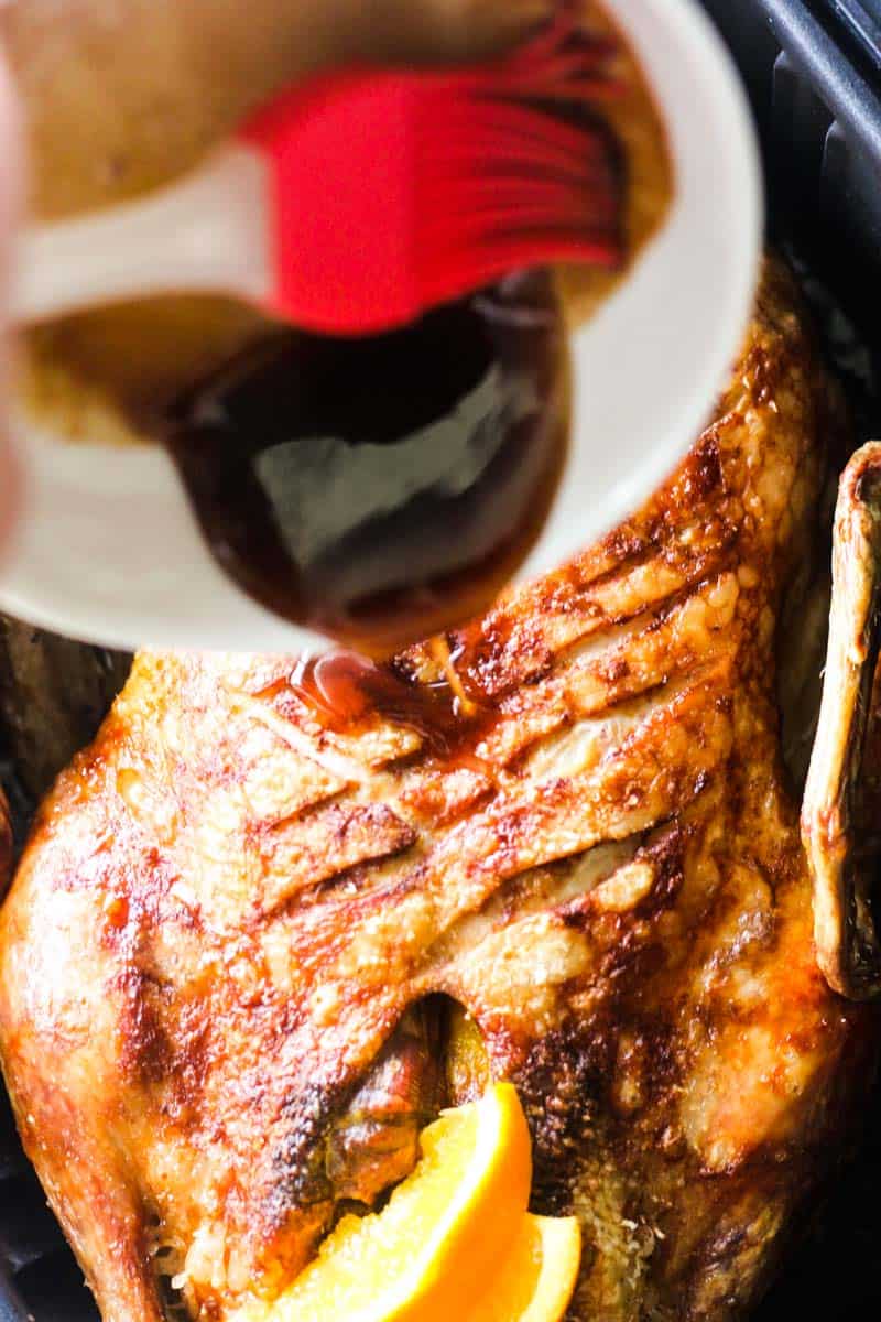 adding sauce to the air fryer duck