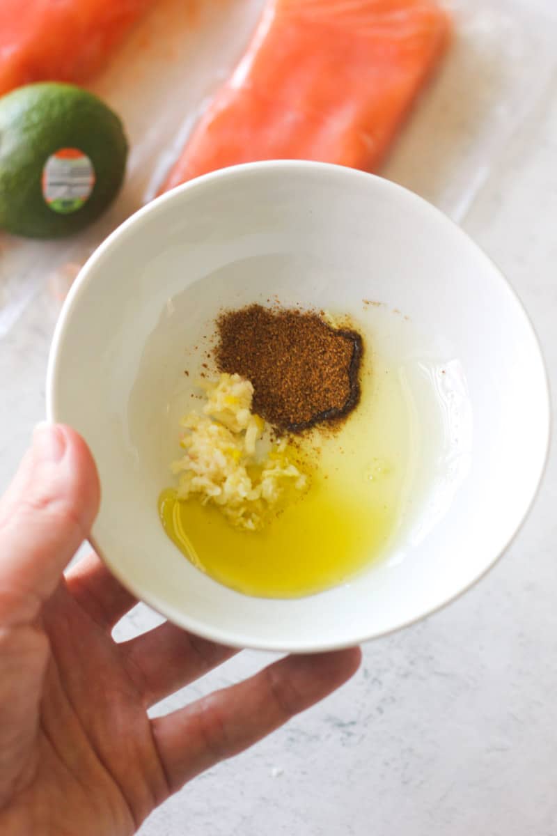 seasoning with oil and minced garlic in a small bowl