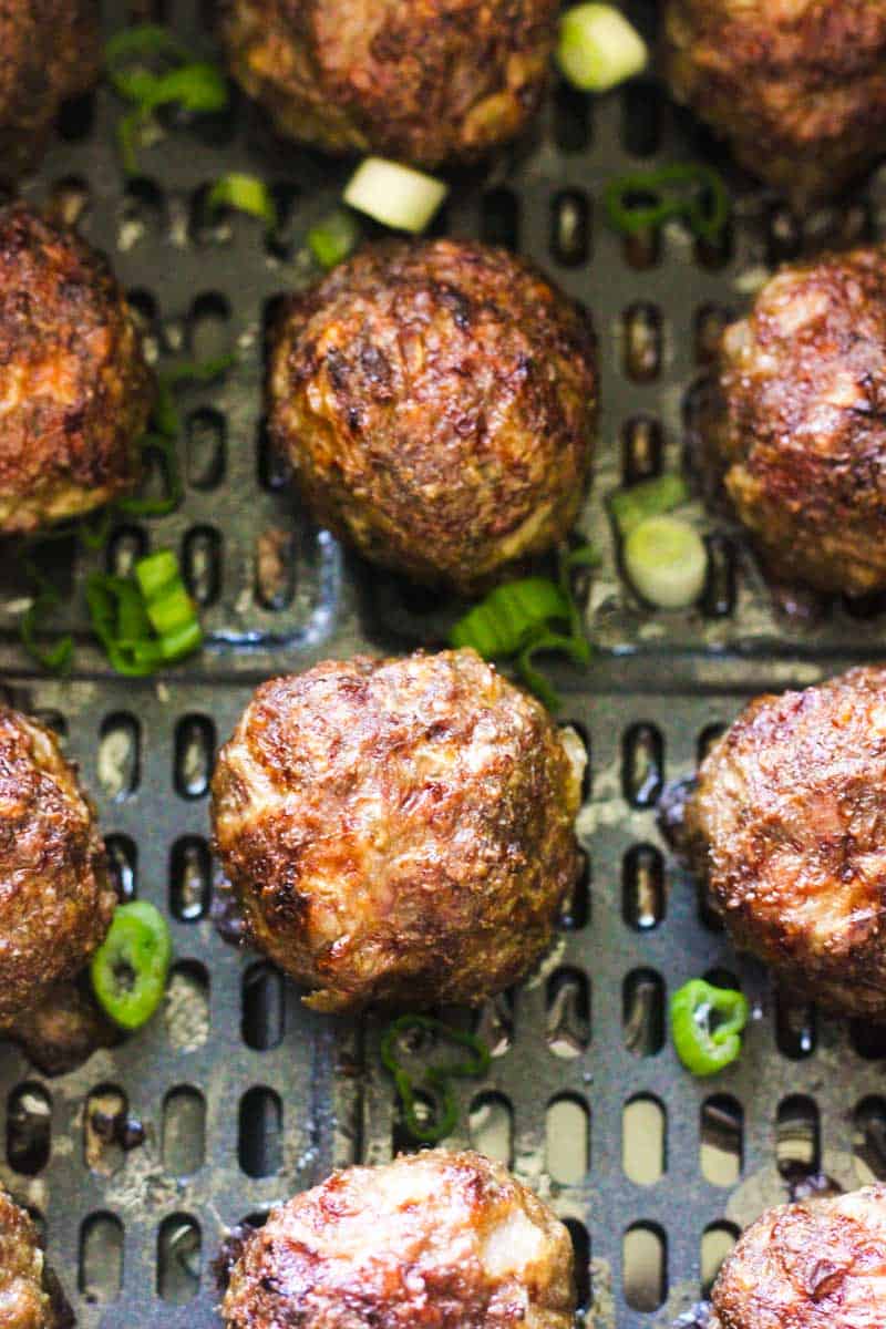 meatballs cooked in air fryer with chopped green onions