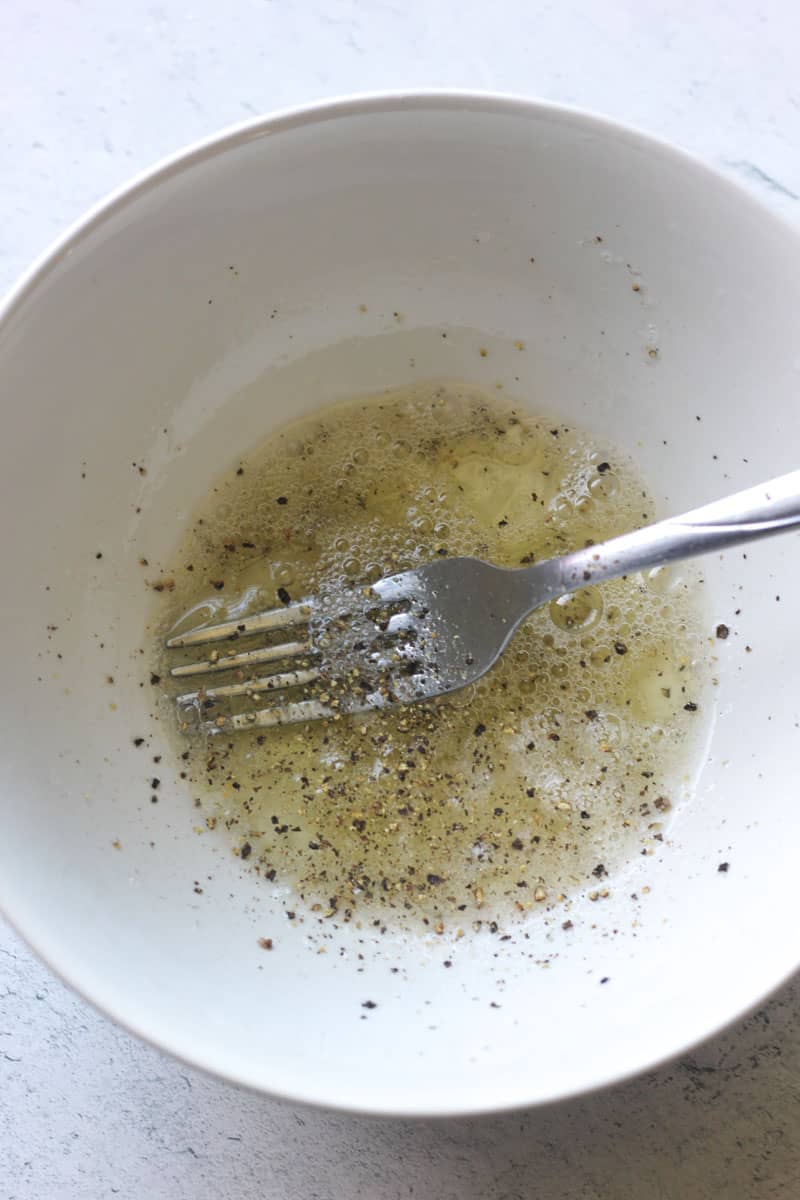 mixed egg white and black pepper in a bowl