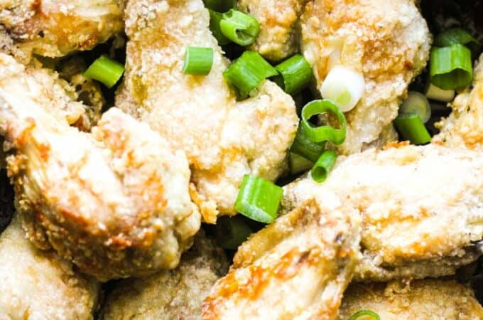 air fryer salt and pepper wings with chopped green onions on top