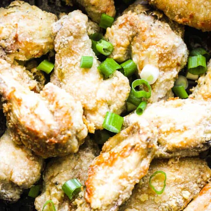 air fryer salt and pepper wings with chopped green onions on top