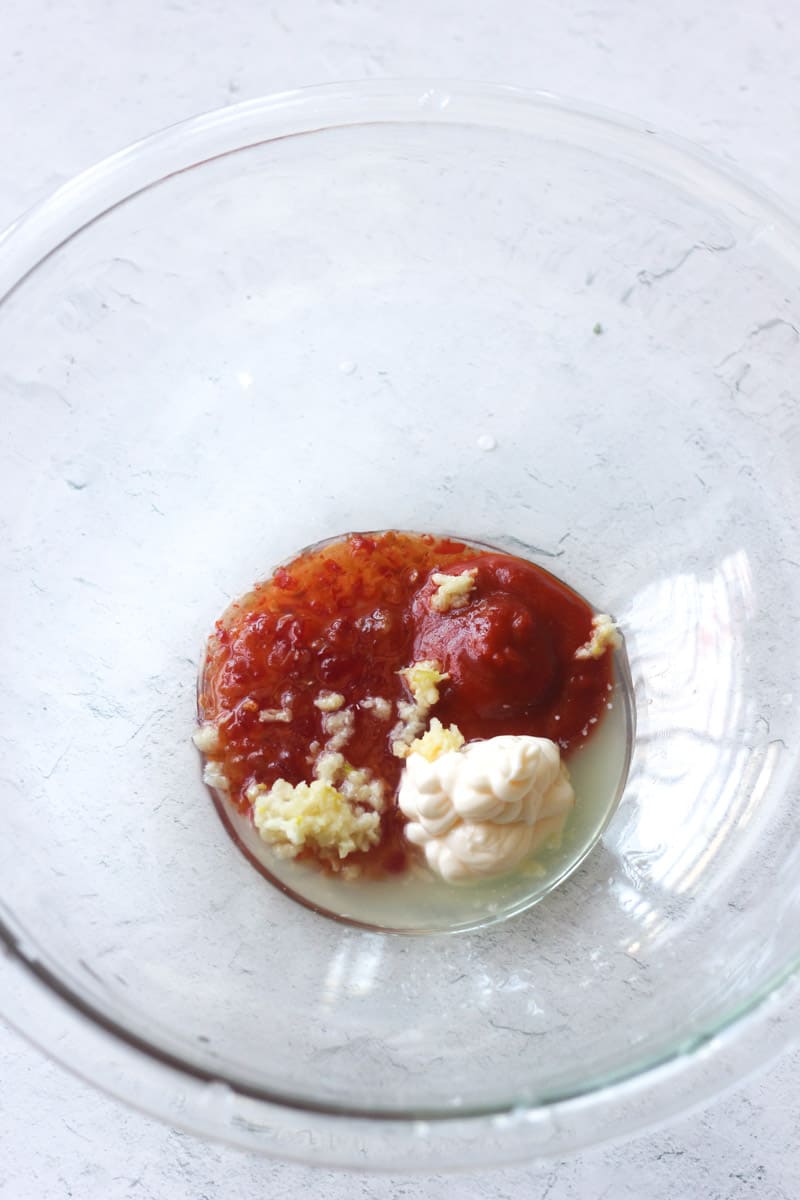 thai sweet sauce with mayo and minced garlic in the glass bowl