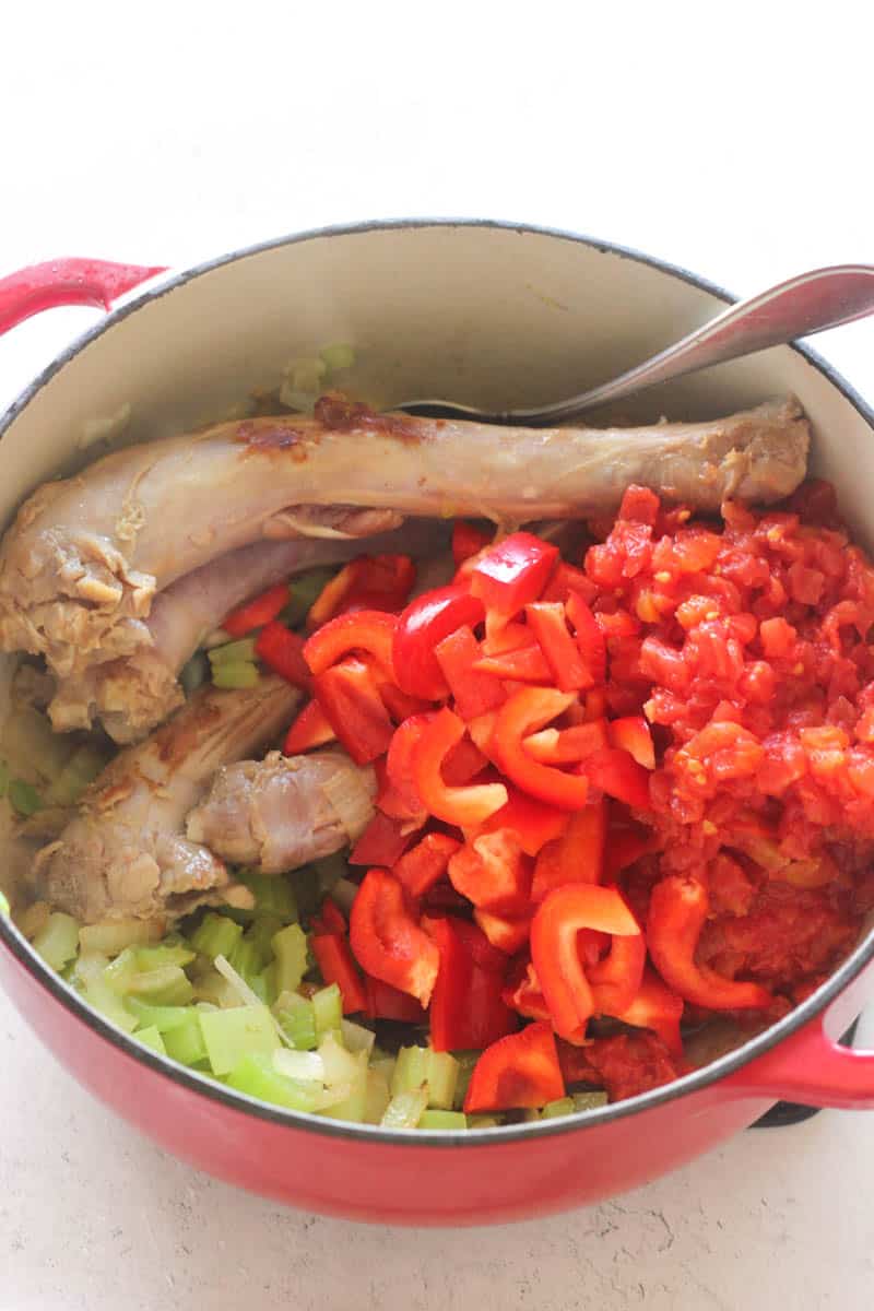 poultry, bell pepper, celery and onion in the pot before cooking