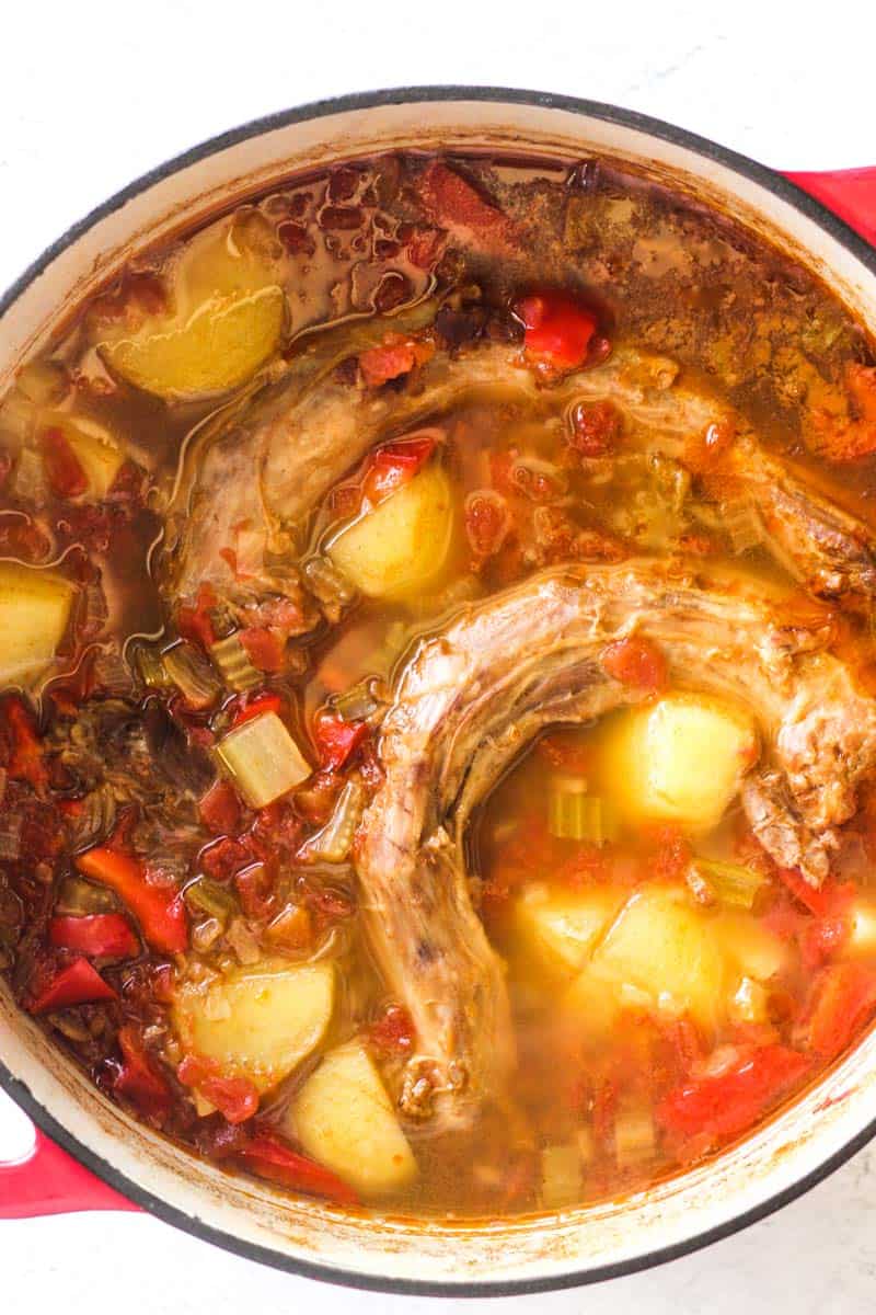 turkey neck soup in red pot