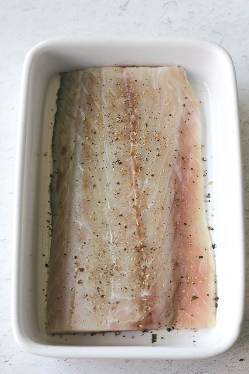 seasoned white fish fillet with salt and pepper