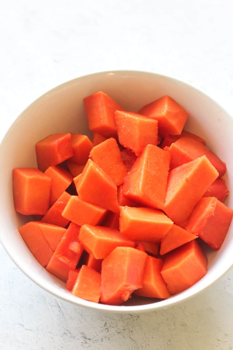 raw fruit cubes in white plate