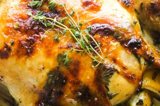 roasted capon with thyme springs on top