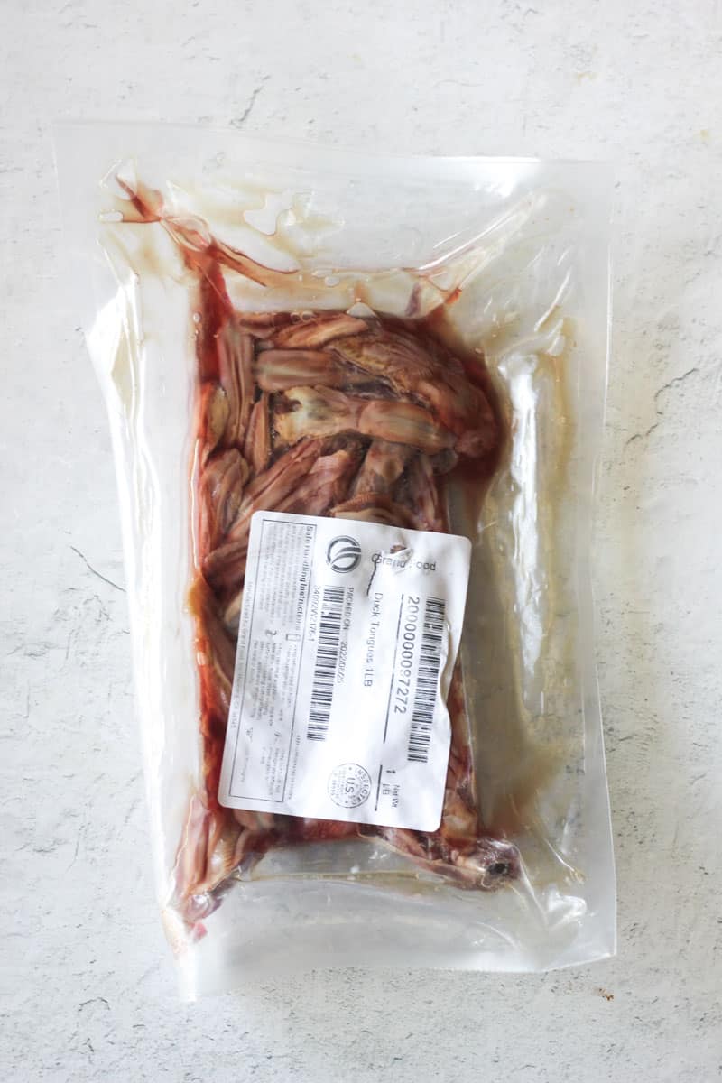 plastic package with raw duck tongues inside