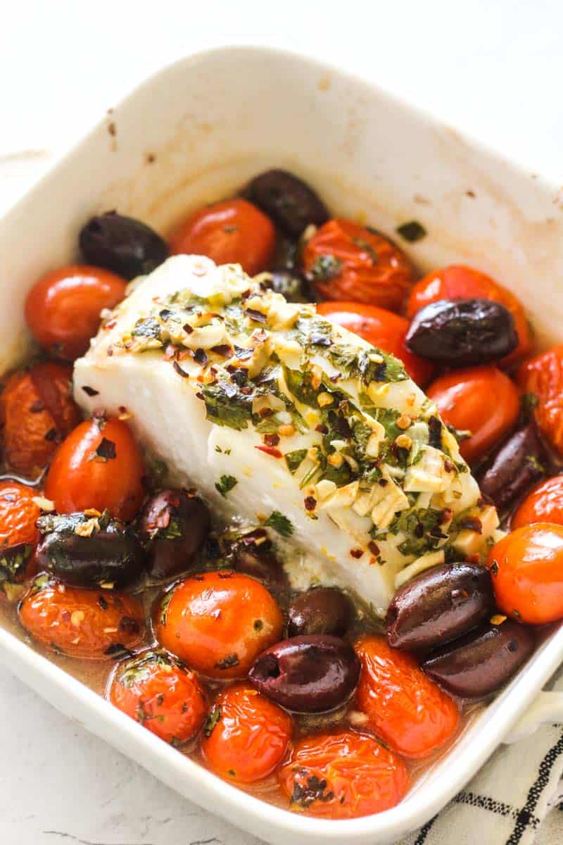 southern hake loin cooked with spices, olives and tomatoes