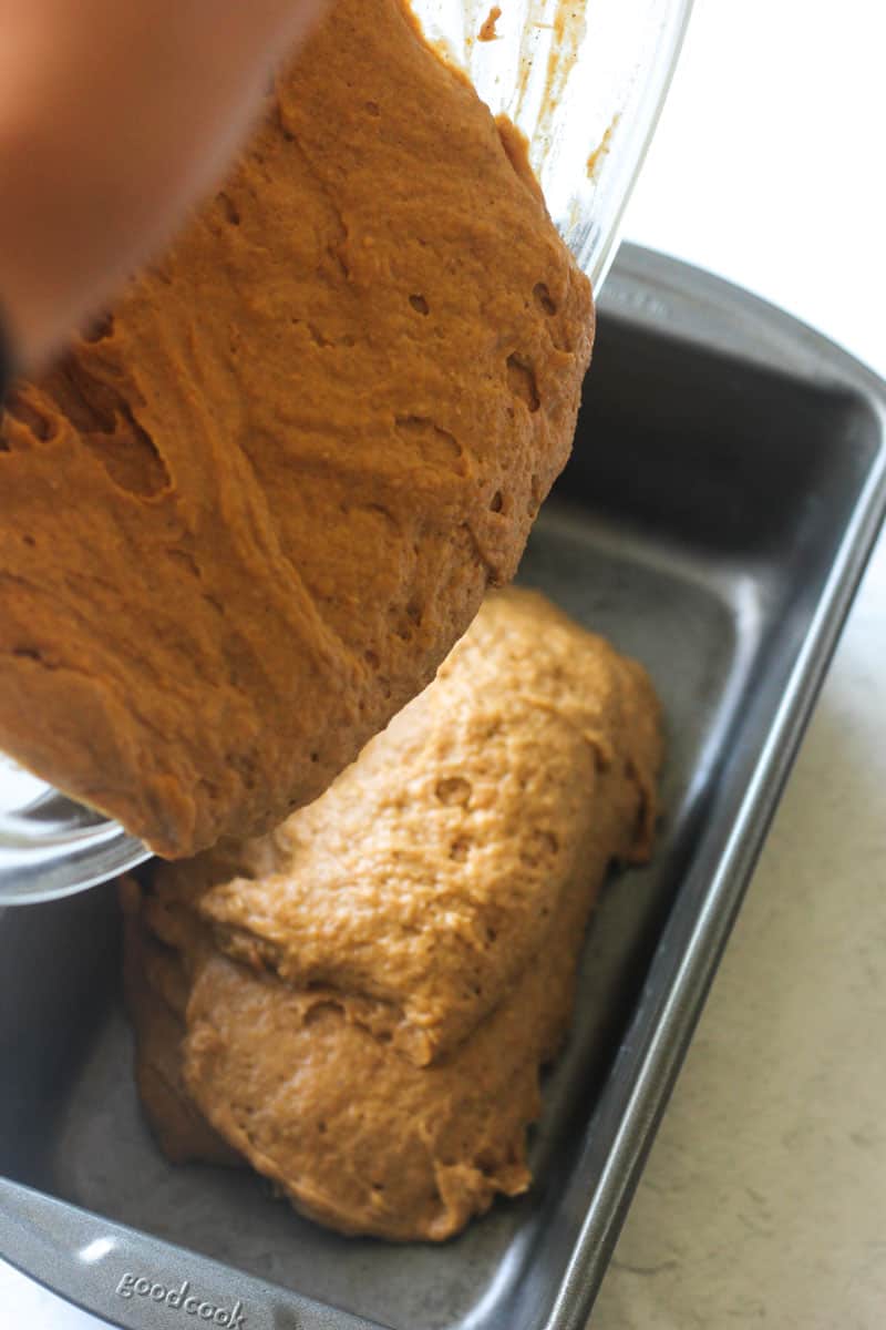 scooping batter in to the loaf pan