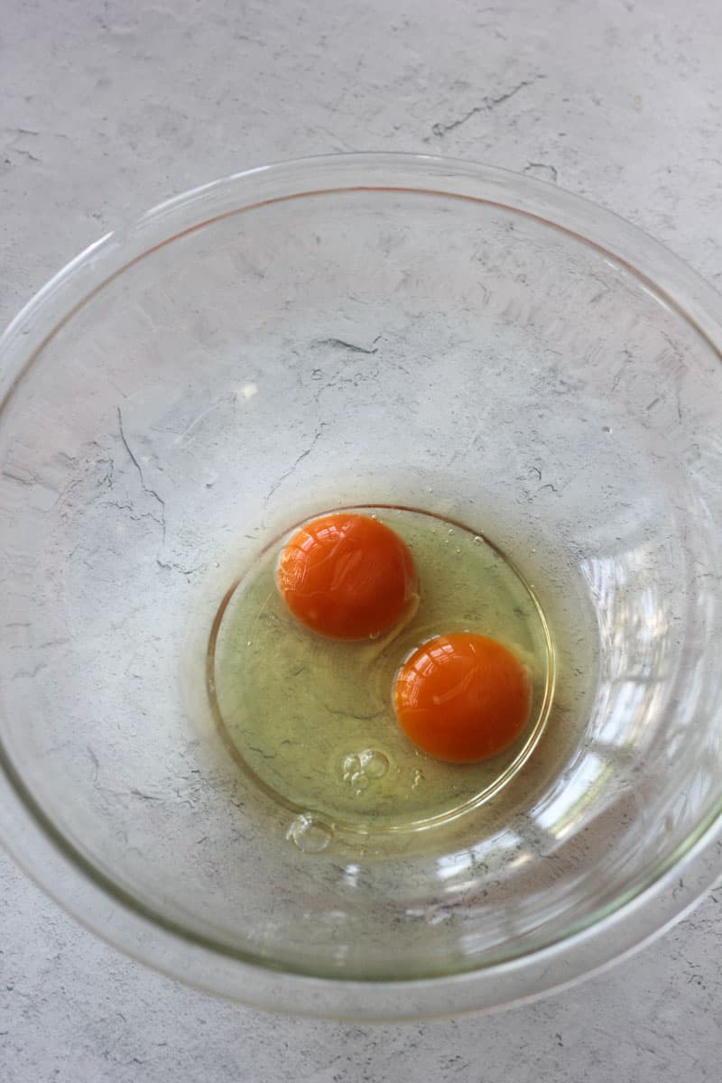 two eggs in glass bowl