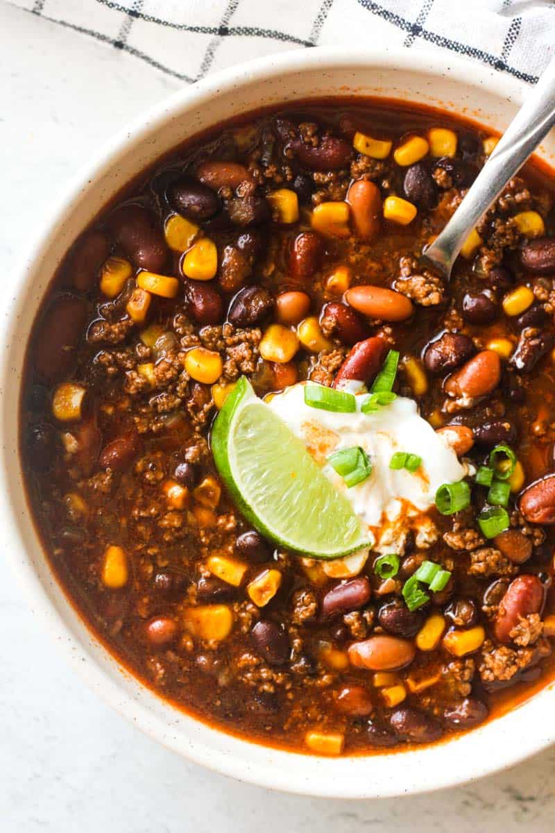 instant pot bison chili in the bowl with lime slice on top