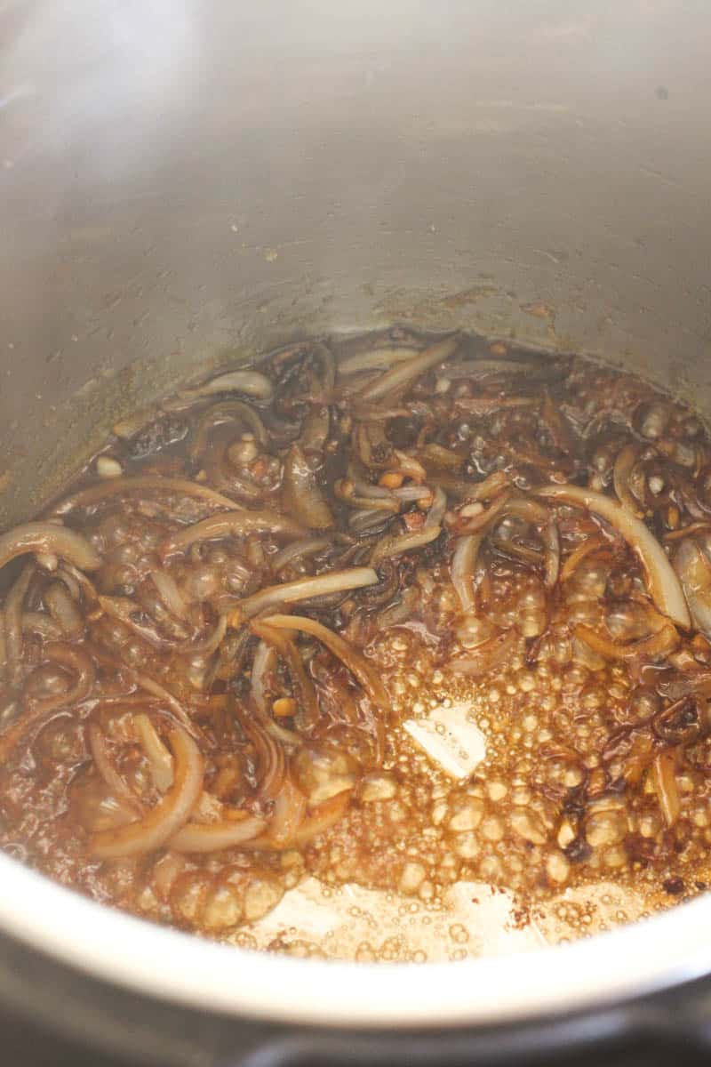 deglazing the pot full of onions
