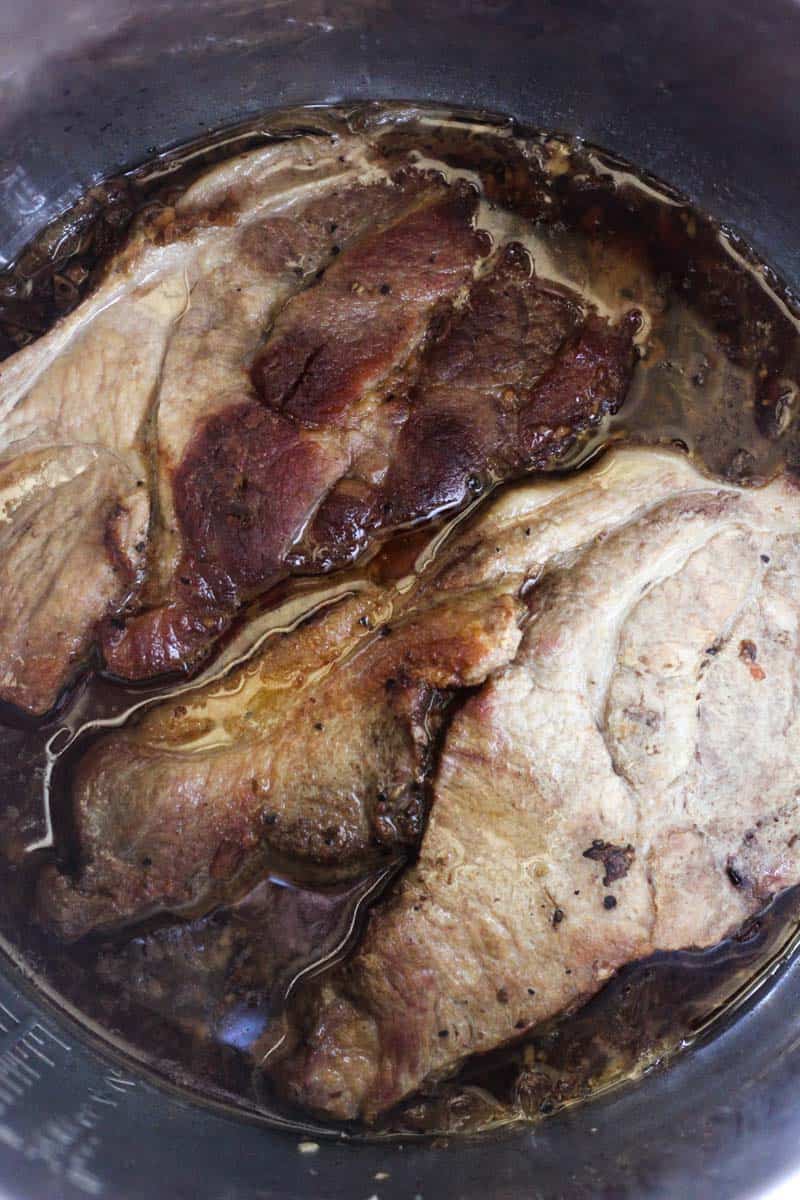 two seared pork steaks in instant pot