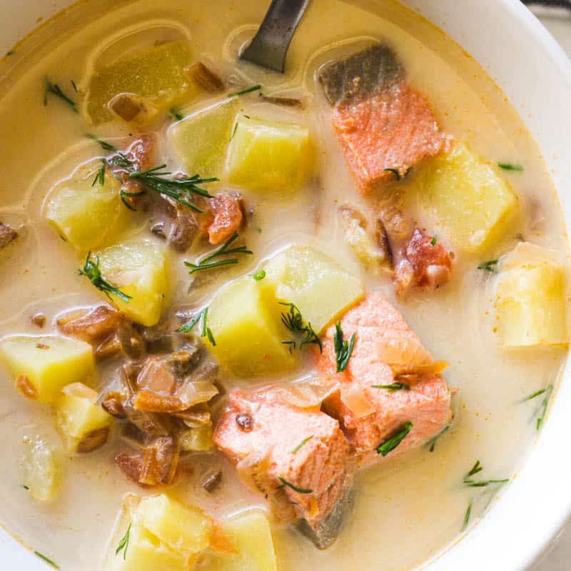 salmon head soup with potatoes and dill on top