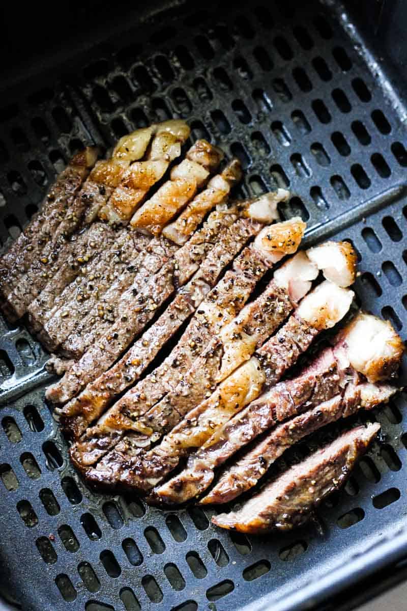 sliced steak in air fryer, top view