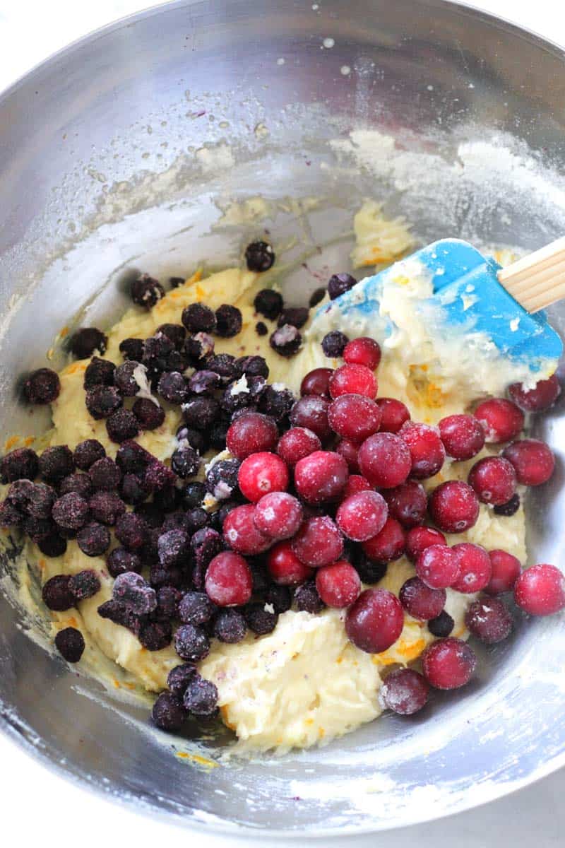 mixing berries in to the batter