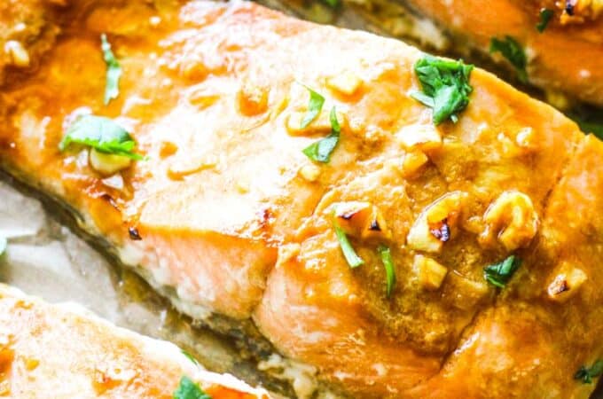 broiled salmon with skin covered with chopped cilantro