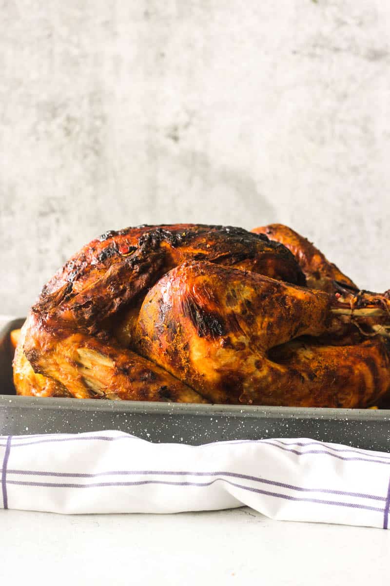Peruvian turkey on the table, whole and bright orange color