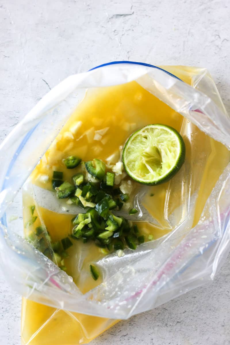 chopped jalapeno, lime and orange juice in the zip lock bag