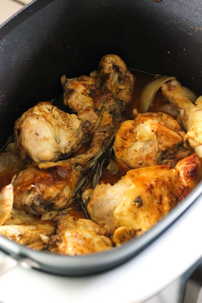 cooked whole chicken cut in pieces in the pot