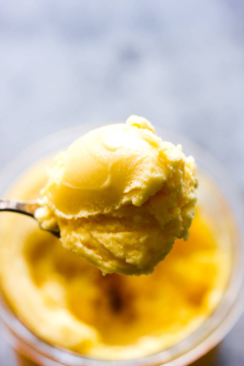 scooping ninja creami mango sorbet from the jar