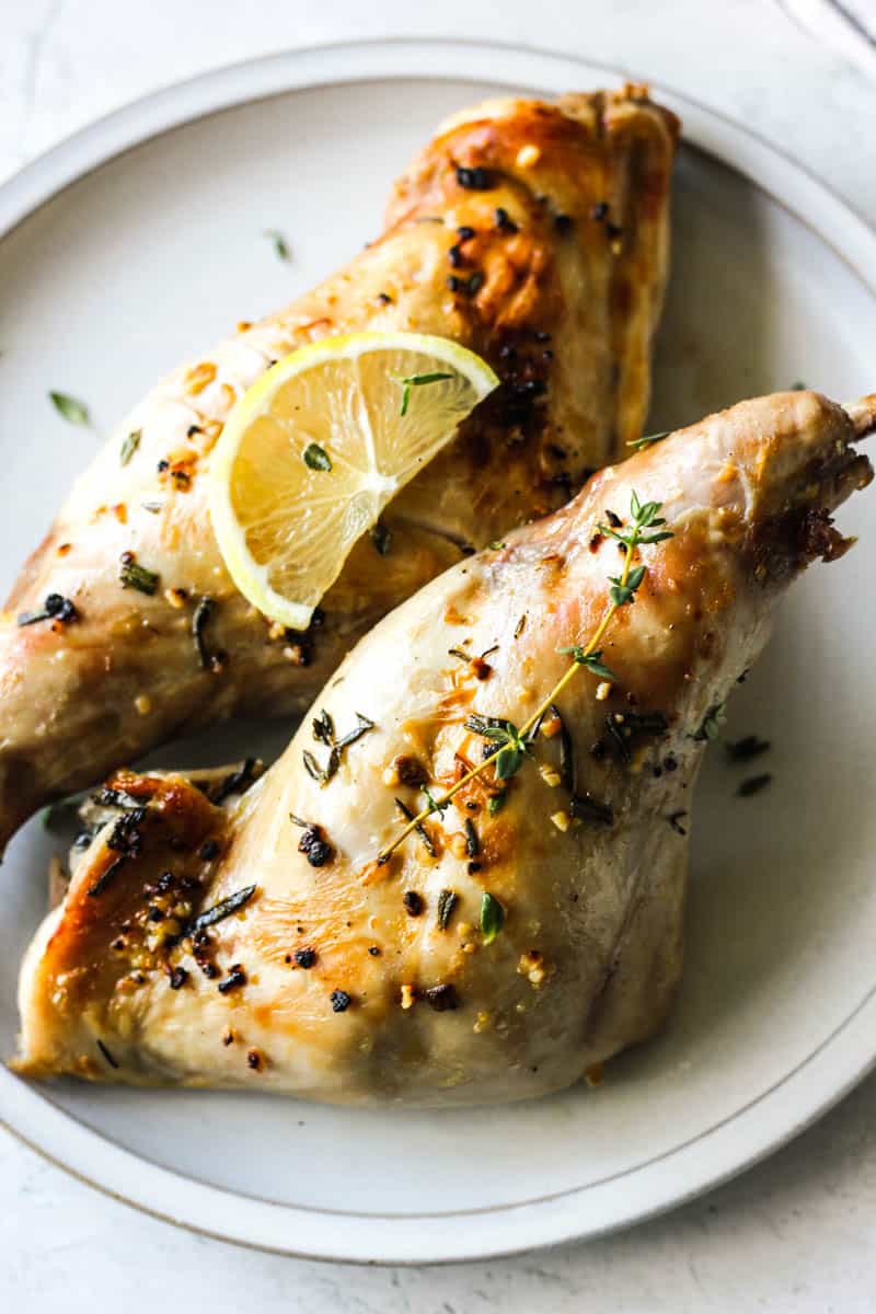 air fryer rabbit legs with thyme on the plate