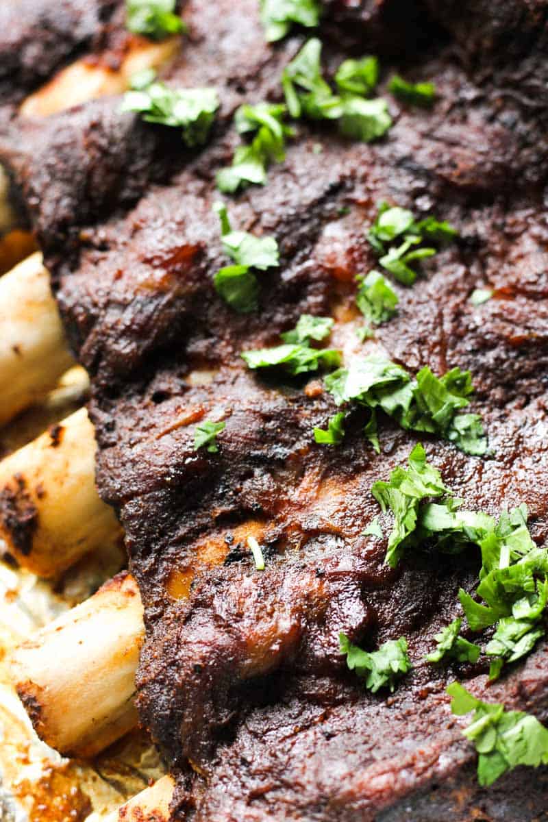 bison ribs, a rack with chopped cilantro on top