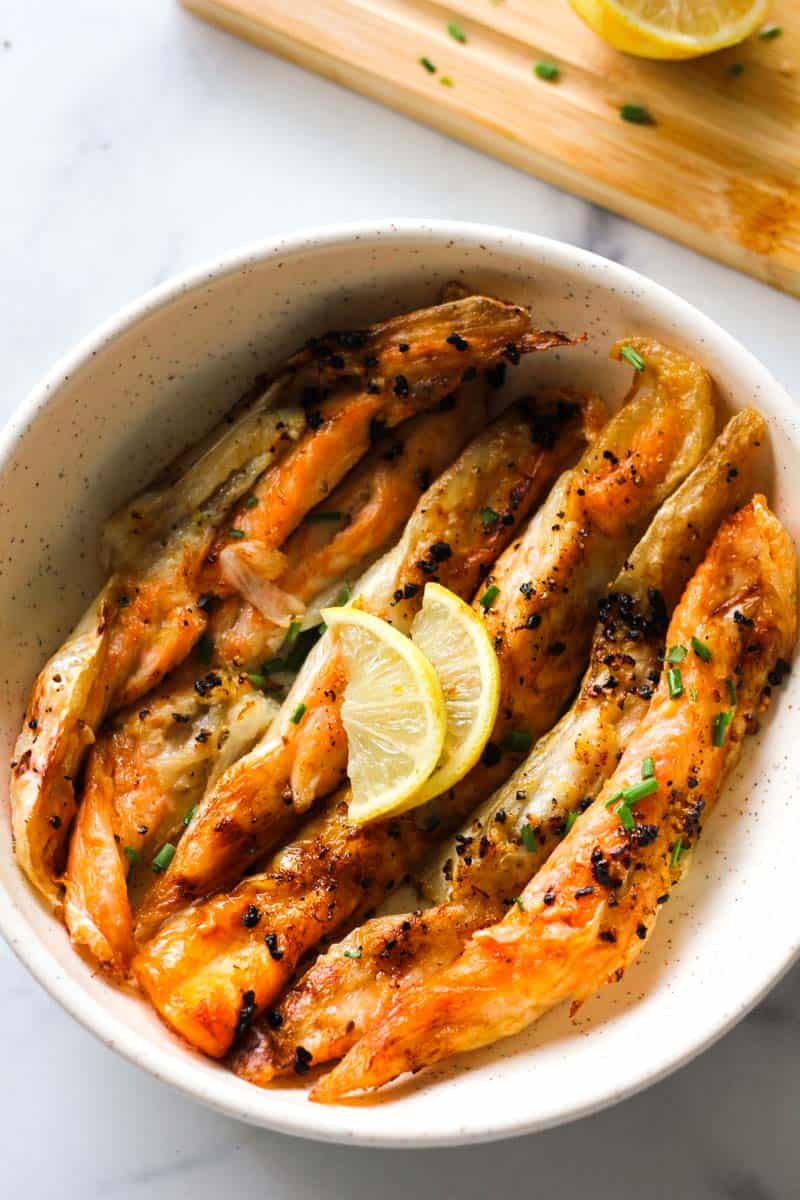 salmon belly stripes in the bowl with lemon
