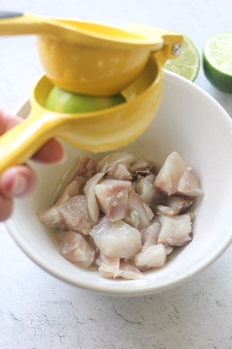 squeezing lime juice over fish