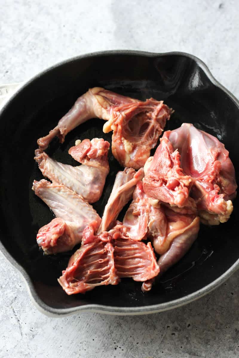 cut up squab in the pan before cooking