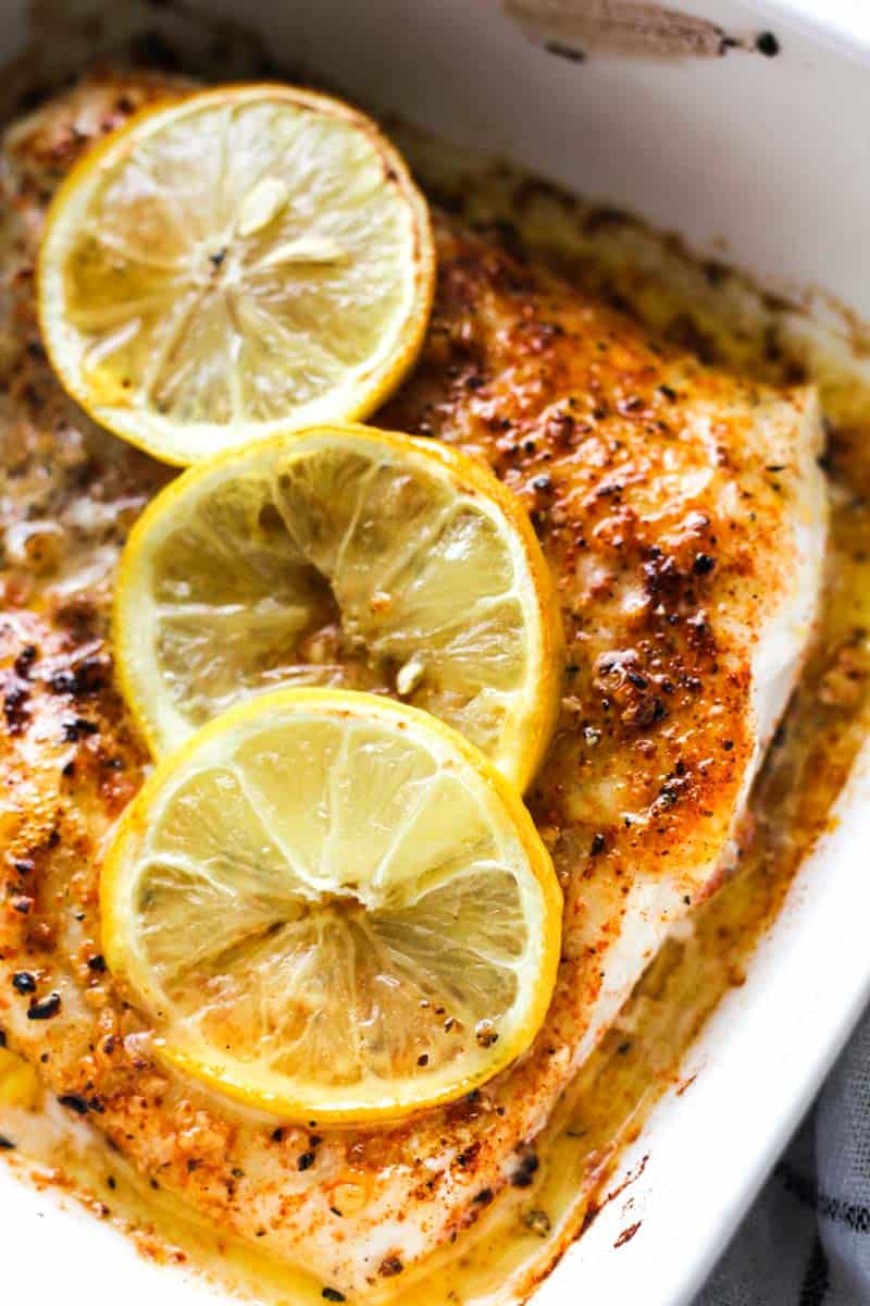 broiled walleye with lemon slices on top