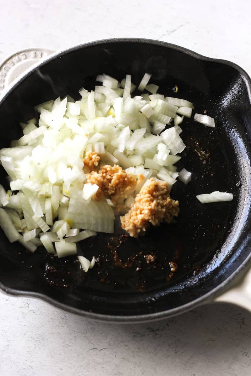 chopped raw onions with minced garlic in the skillet